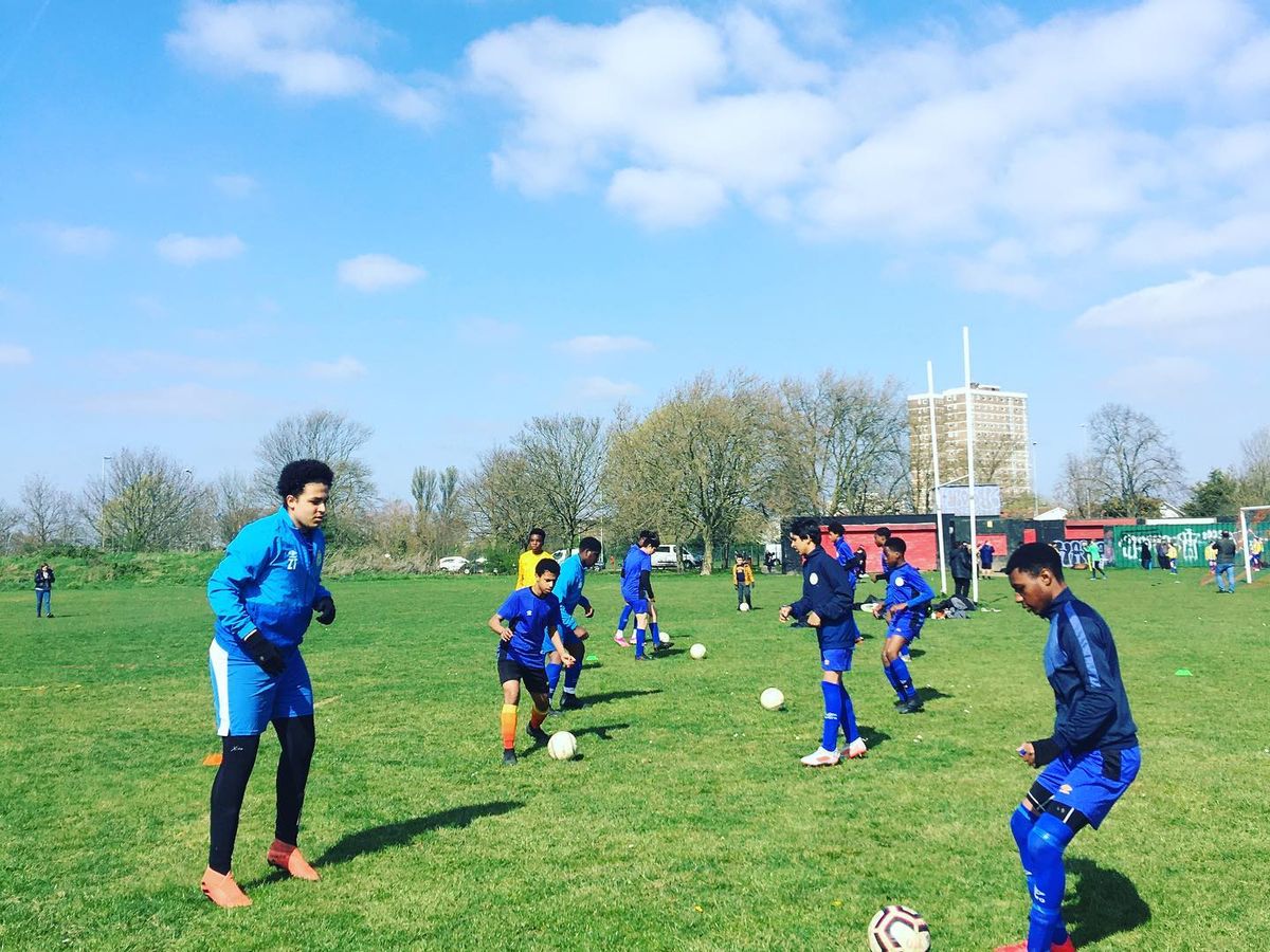 Shooting Stars players training with footballs on a sunny Saturday