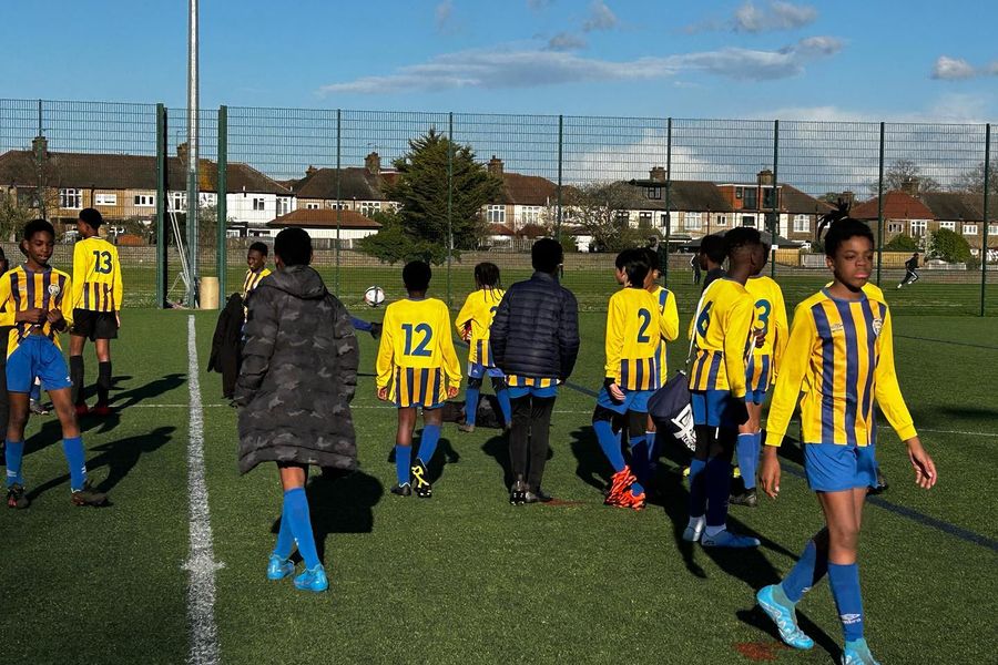 A Shooting Stars youth team walking out on match day
