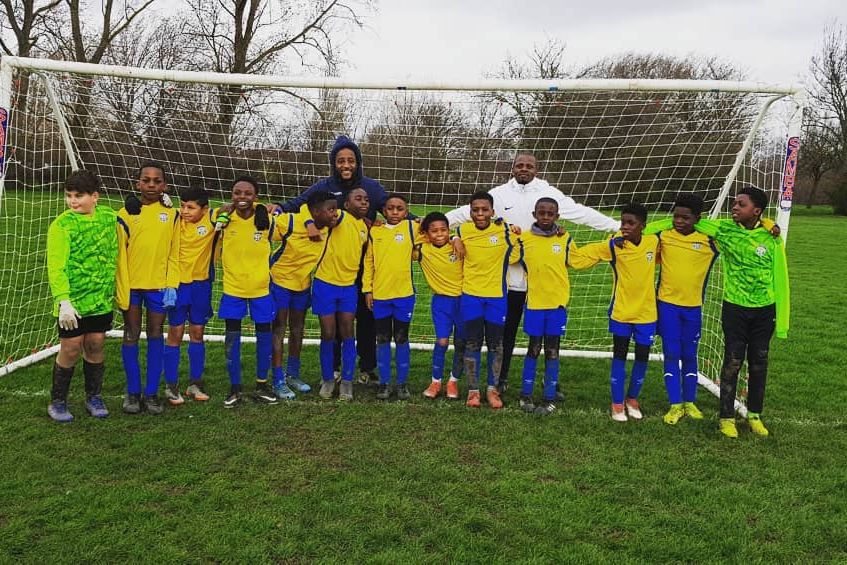 A Shooting Stars team lined up in front of the goal